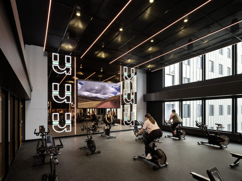 Illuminated Union logo on mirrored walls of the Union on 24th spin studio